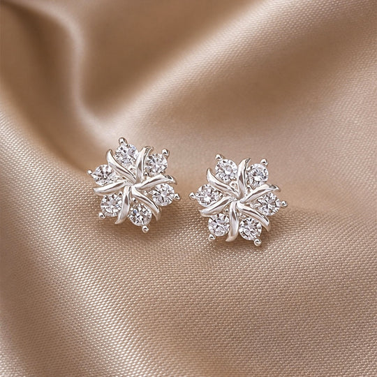 Boucles d'oreilles en or blanc en forme de flocon de neige