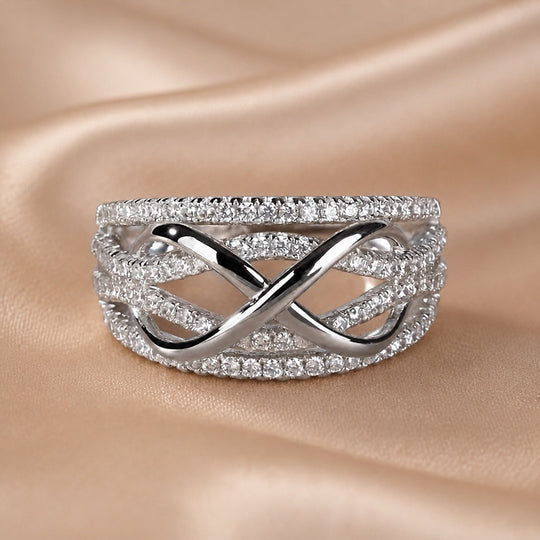 Bague "Infinie" en zirconium plaqué or blanc