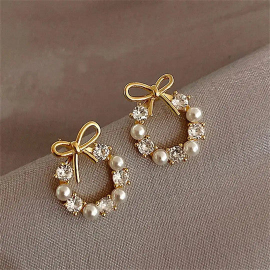 Boucles d'oreilles clous en perles en forme de nœud