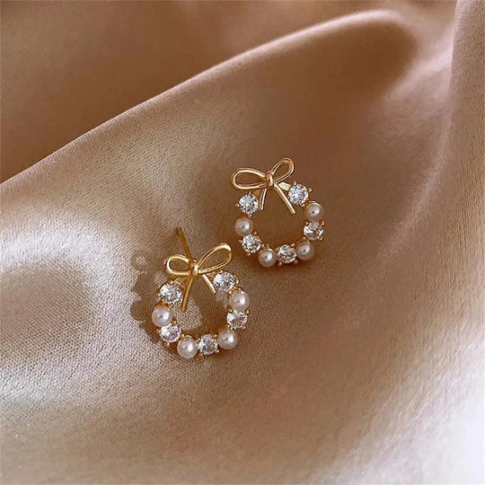 Boucles d'oreilles clous en perles en forme de nœud