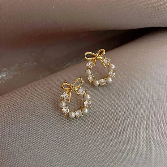 Boucles d'oreilles clous en perles en forme de nœud