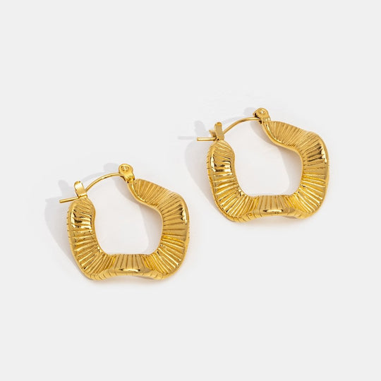Boucles d'oreilles créoles en or à motif géométrique