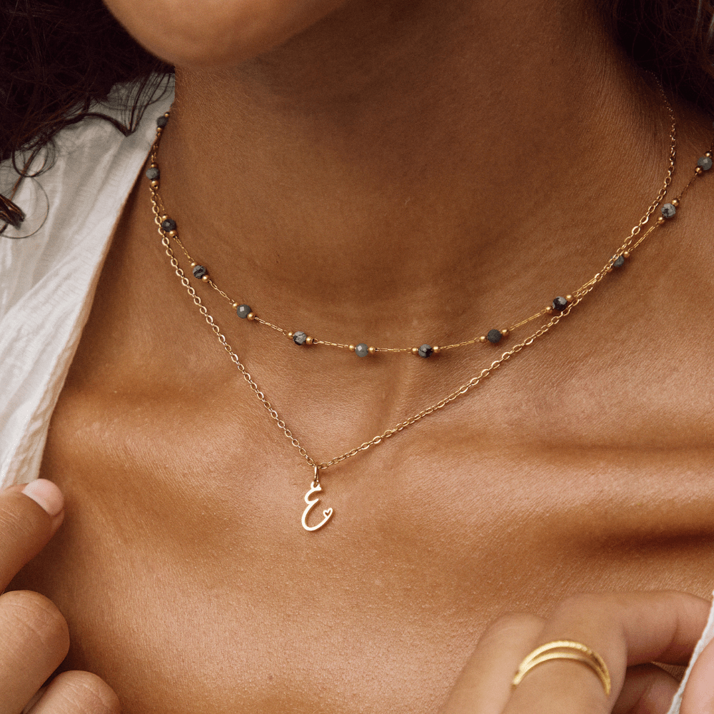 Collier en cœur avec lettre en or
