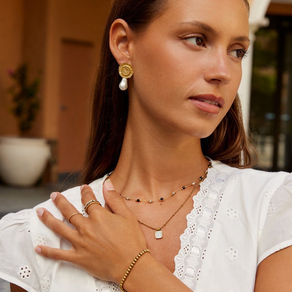 Boucles d'oreilles pendantes en fleur de perle