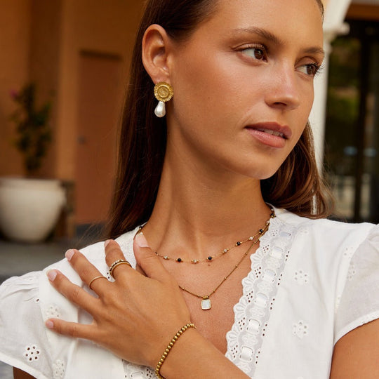 Boucles d'oreilles pendantes en fleur de perle