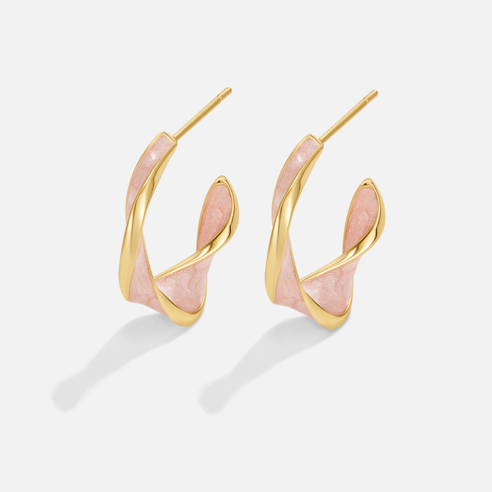 Boucles d'oreilles créoles torsadées en nacre rose