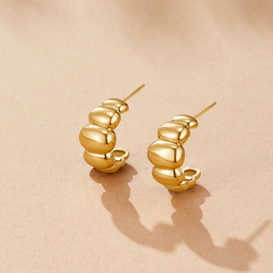 Boucles d'oreilles Puff en or Rene